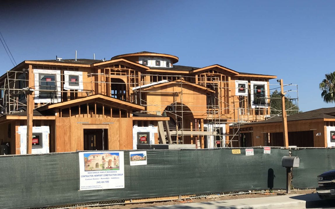 Custom window installation and framing phase by Newport Construction Group